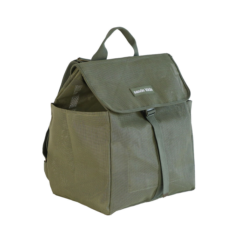 A studio image of the Sande Kids™ Beach Hauler mesh backpack in Pandanus Green, displayed at a 45° angle to highlight its functional design. This view showcases the flap with a plastic clip, adjustable straps, large side mesh pockets, and a convenient handle at the top. The backpack is set against a clean white background, emphasizing its durability and practicality for beach adventures.