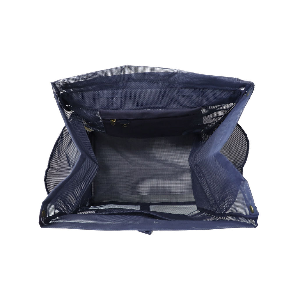 This studio image shows the Sande Kids™ Beach Hauler mesh backpack in Deep Sea Navy from the top view. It highlights the thick canvas pocket for valuables and a key clip for added security, along with a large mesh pocket to help keep everything organised and easily accessible.