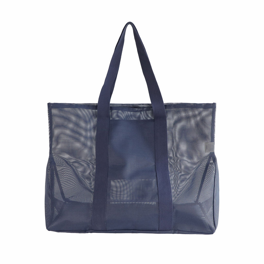Oversized Sande Kids Beach Hauler mesh beach bag in Deep Sea Navy, displayed in a studio setting. Shown from the rear to highlight the breathable mesh design, thick cotton straps. Set against a white background.