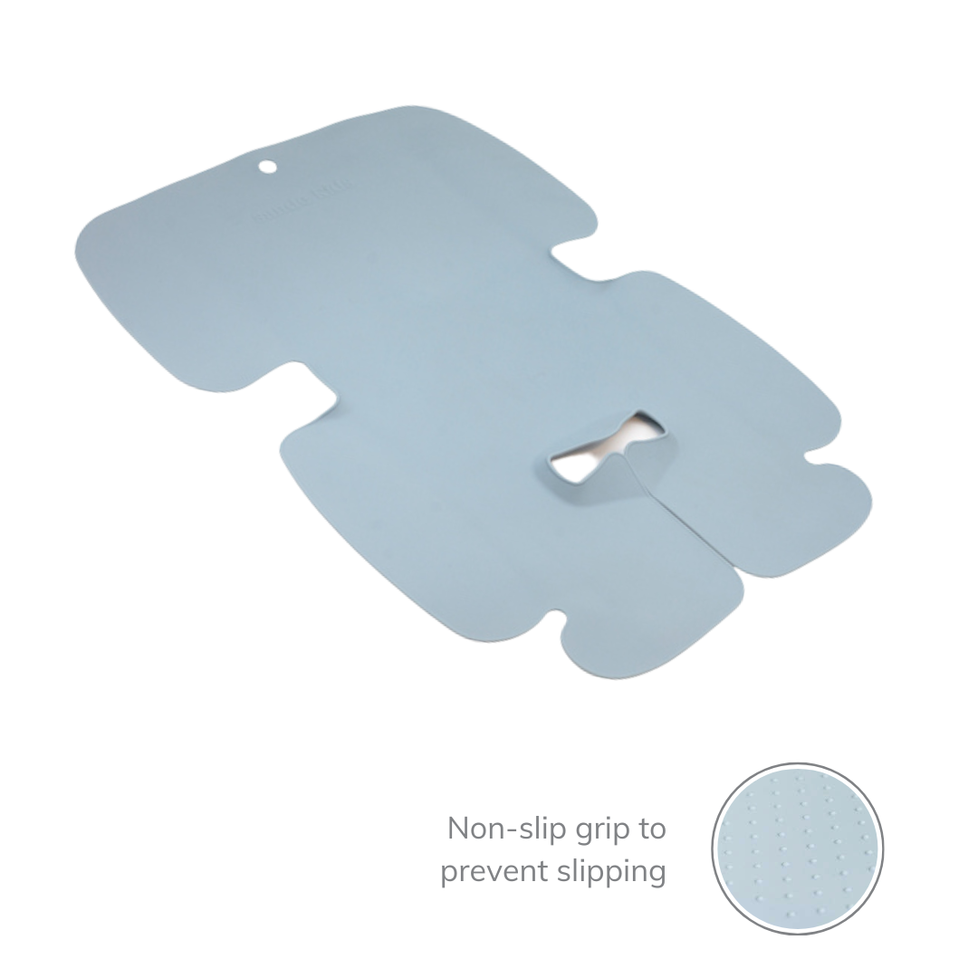 The Sande Kids™ waterproof car seat and pram liner is shown laid out flat, highlighting the molded design around the crotch buckle. A small inset image shows the non-stick grip on the back to prevent slipping, ensuring stability and safety.