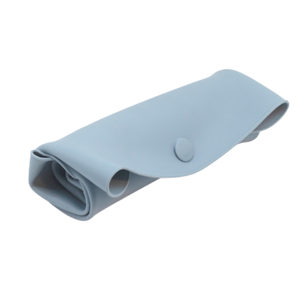 The Sande Kids™ waterproof car seat and pram liner in Ocean Blue is rolled and secured with a silicone button. This studio image with a white background highlights the compact roll of the liner, making it easy to store.