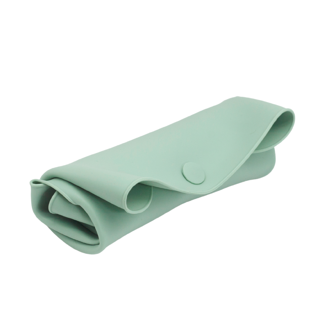 The Sande Kids™ waterproof car seat and pram liner in Swagman Green is rolled and secured with a silicone button. This studio image, set against a white background, showcases the compact, space-efficient design of the liner, perfect for easy storage.