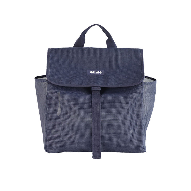 Studio image of the Sande Kids™ Beach Hauler mesh backpack in Deep Sea Navy, showing the front view. Features include a top carry handle, two side mesh pockets, a flap with a clip for security, and a silicone label with the Sande Kids™ logo in white.