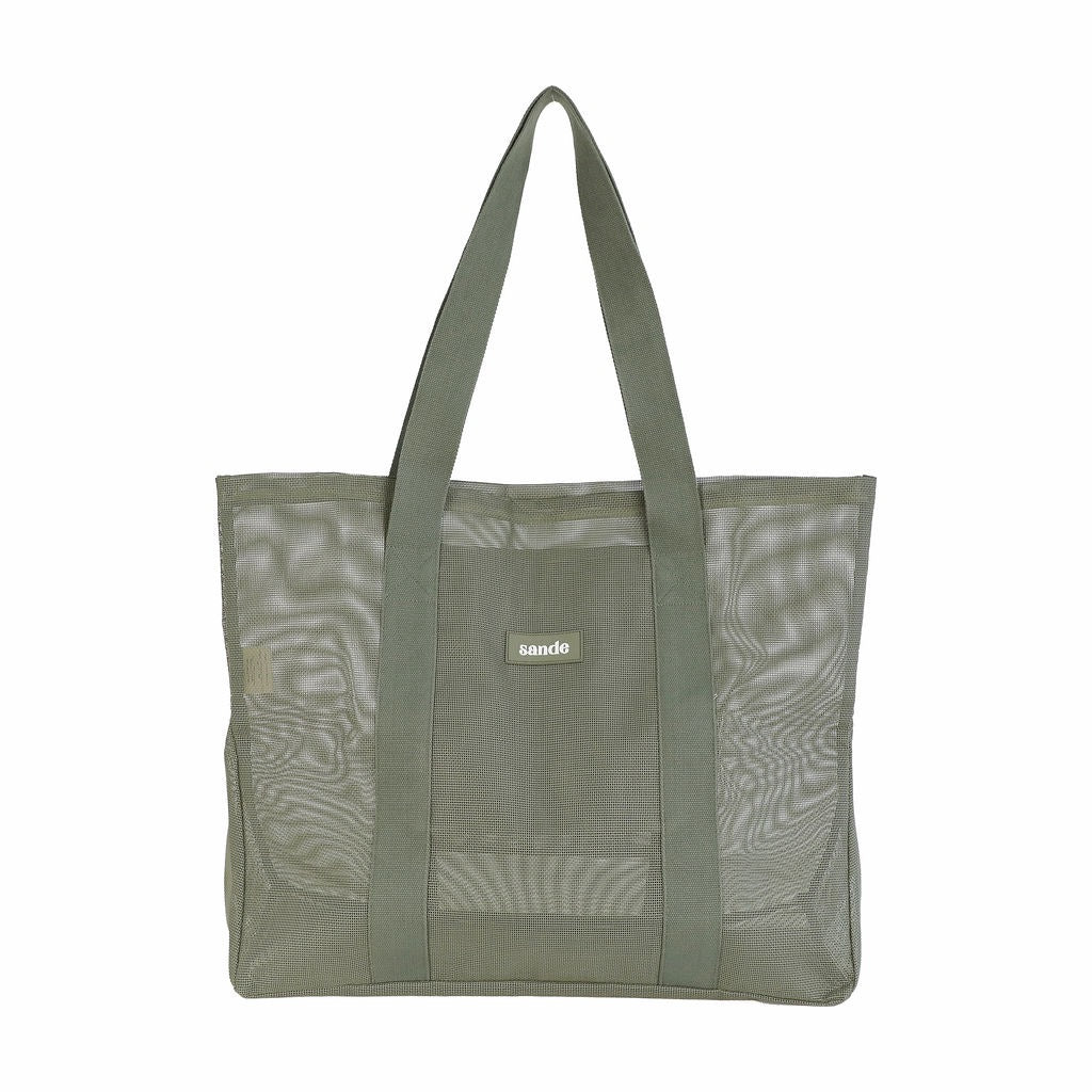 Front view of Sande Kids Beach Hauler -Mini mesh beach bag in Pandanus green, shown on a white background, highlighting its large unique design.