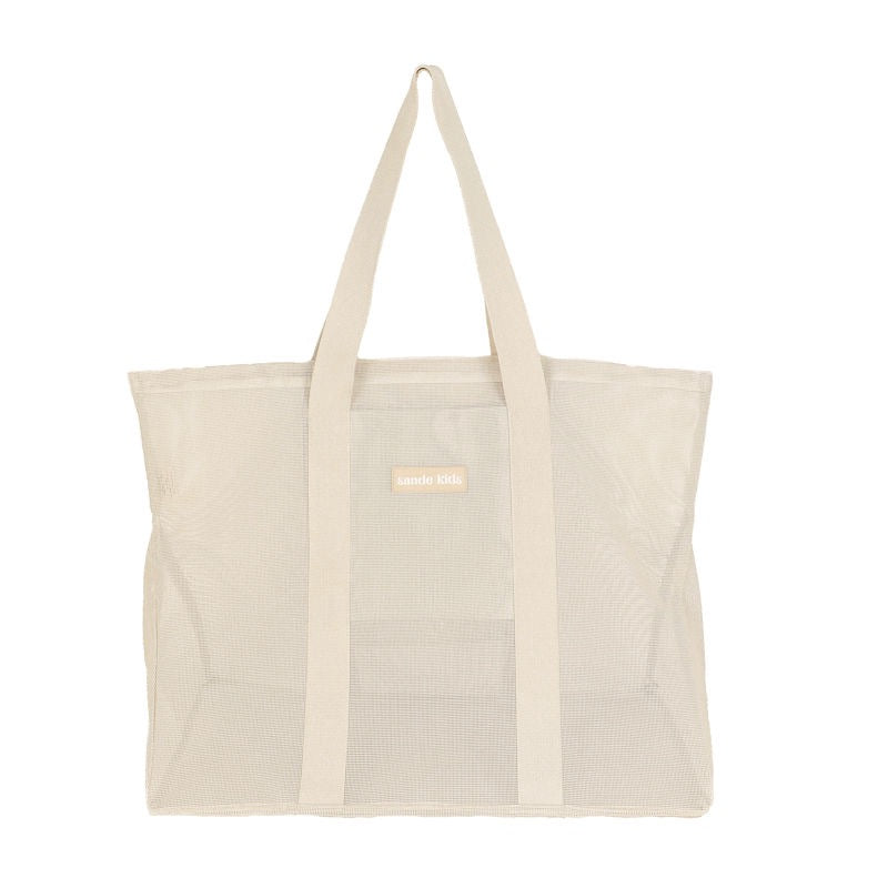 Front view product photo of the original Sande Kids Beach Hauler mesh beach bag in Sand Dune / neutral.