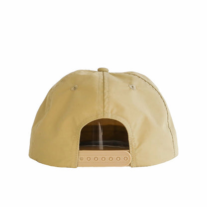 A beige cap made from waterproof nylon fabric, shown from the rear. The cap features a plastic snapback and the Sande Kids™ logo embroidered in white on the front.